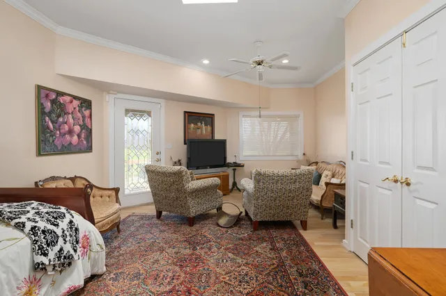 a kitchen with granite countertop a sink a counter top space and living room view