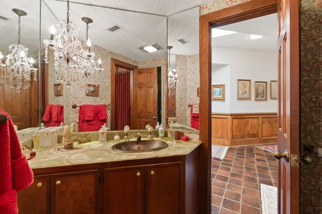 a bedroom with furniture and a flat screen tv