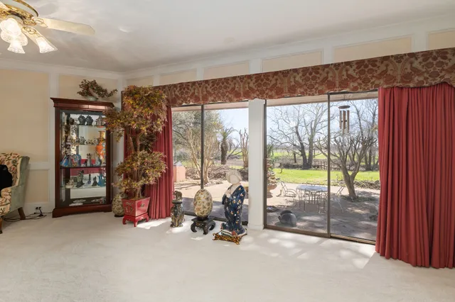 a bed room with furniture and a window