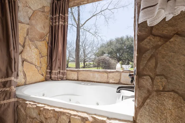a kitchen with stainless steel appliances granite countertop a sink and refrigerator