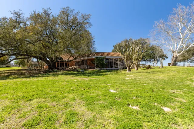 a view of parking garage with cars