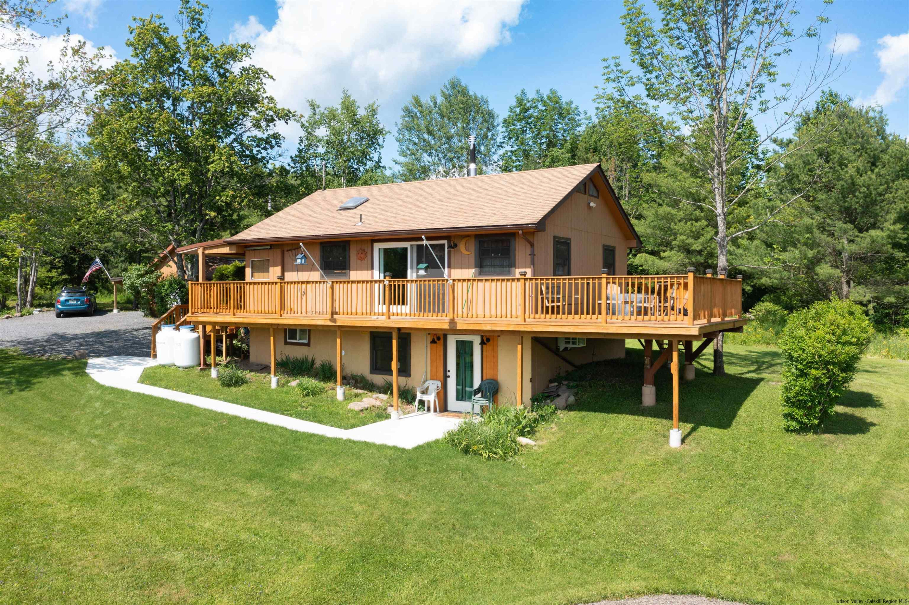 356 C Buel Road Gilboa, NY 12076 - Photo 9 of 30 a view of a house with a yard balcony and sitting area