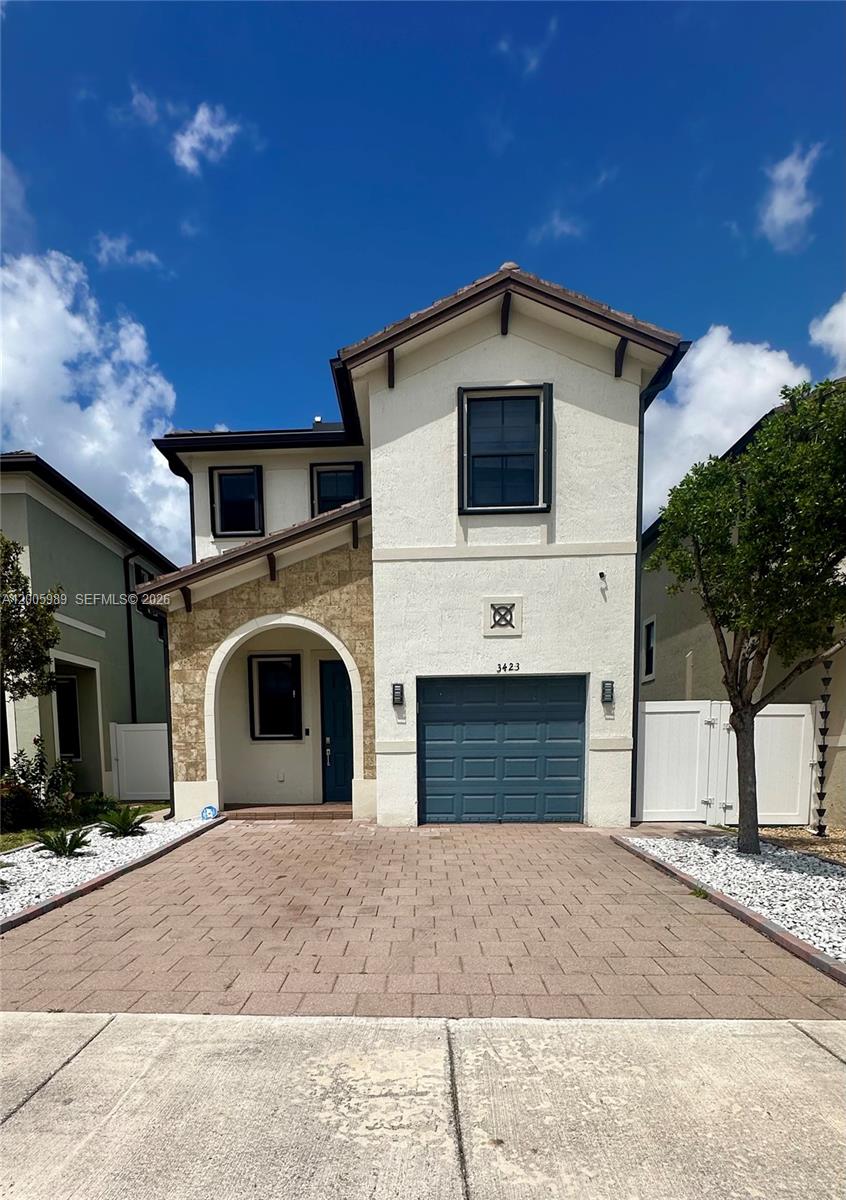 3423 West 110th Street Hialeah, FL 33018 - Photo 1 of 42 a view of a house with a yard