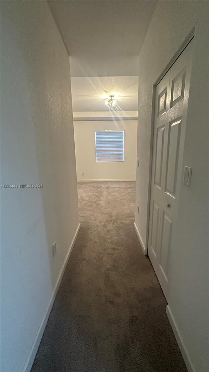 3423 West 110th Street Hialeah, FL 33018 - Photo 14 of 42 a view of hallway with closet