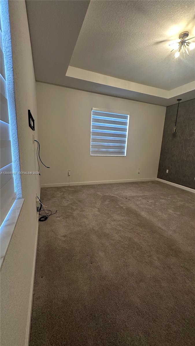 3423 West 110th Street Hialeah, FL 33018 - Photo 16 of 42 an empty room with windows