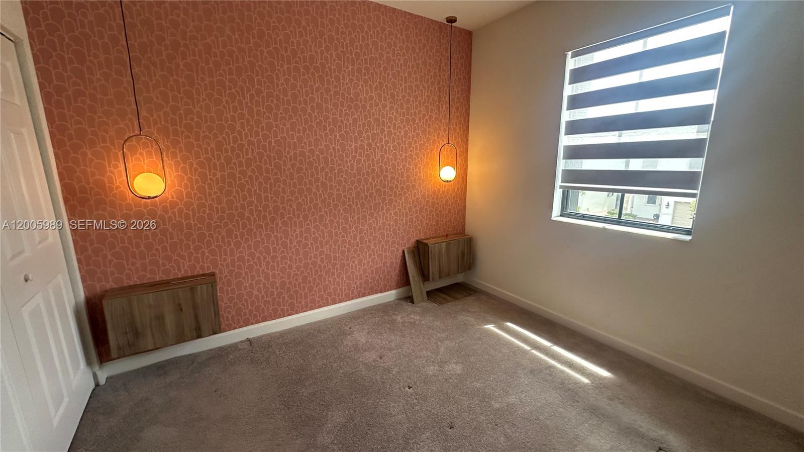 3423 West 110th Street Hialeah, FL 33018 - Photo 20 of 42 an empty room with windows
