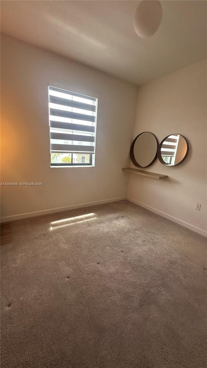 3423 West 110th Street Hialeah, FL 33018 - Photo 21 of 42 a view of a room with windows