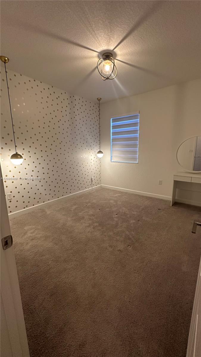3423 West 110th Street Hialeah, FL 33018 - Photo 25 of 42 a view of an empty room with a window