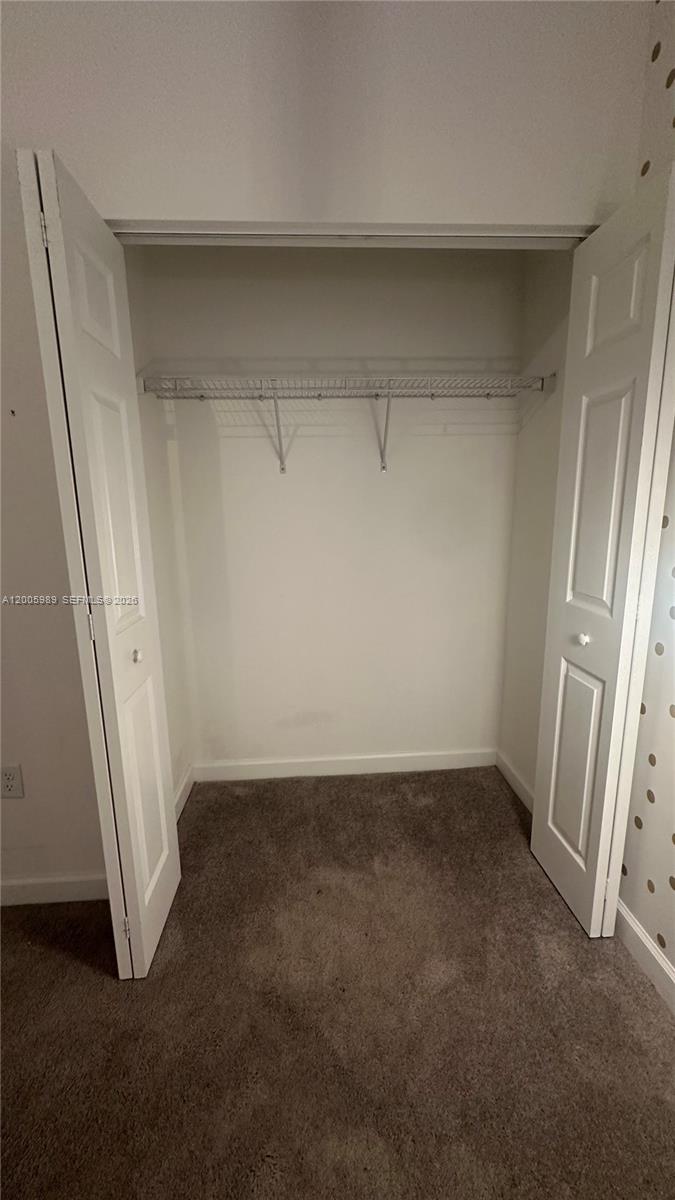 3423 West 110th Street Hialeah, FL 33018 - Photo 26 of 42 an empty room with a bench