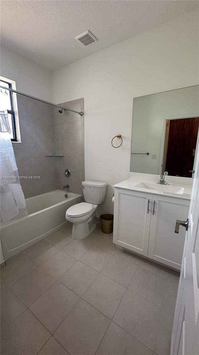 3423 West 110th Street Hialeah, FL 33018 - Photo 28 of 42 a bathroom with a sink a toilet and shower