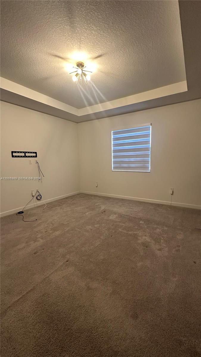 3423 West 110th Street Hialeah, FL 33018 - Photo 37 of 42 an empty room with a empty space and windows