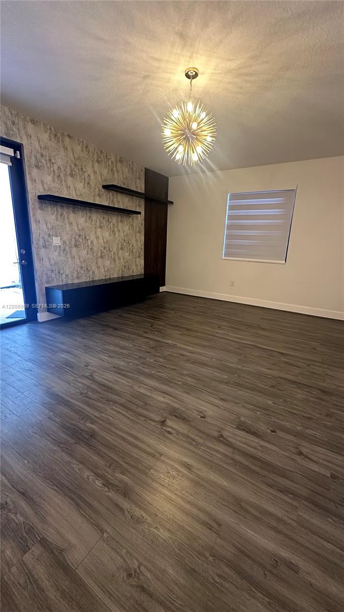 3423 West 110th Street Hialeah, FL 33018 - Photo 6 of 42 a living room with hard wood floors and a fireplace