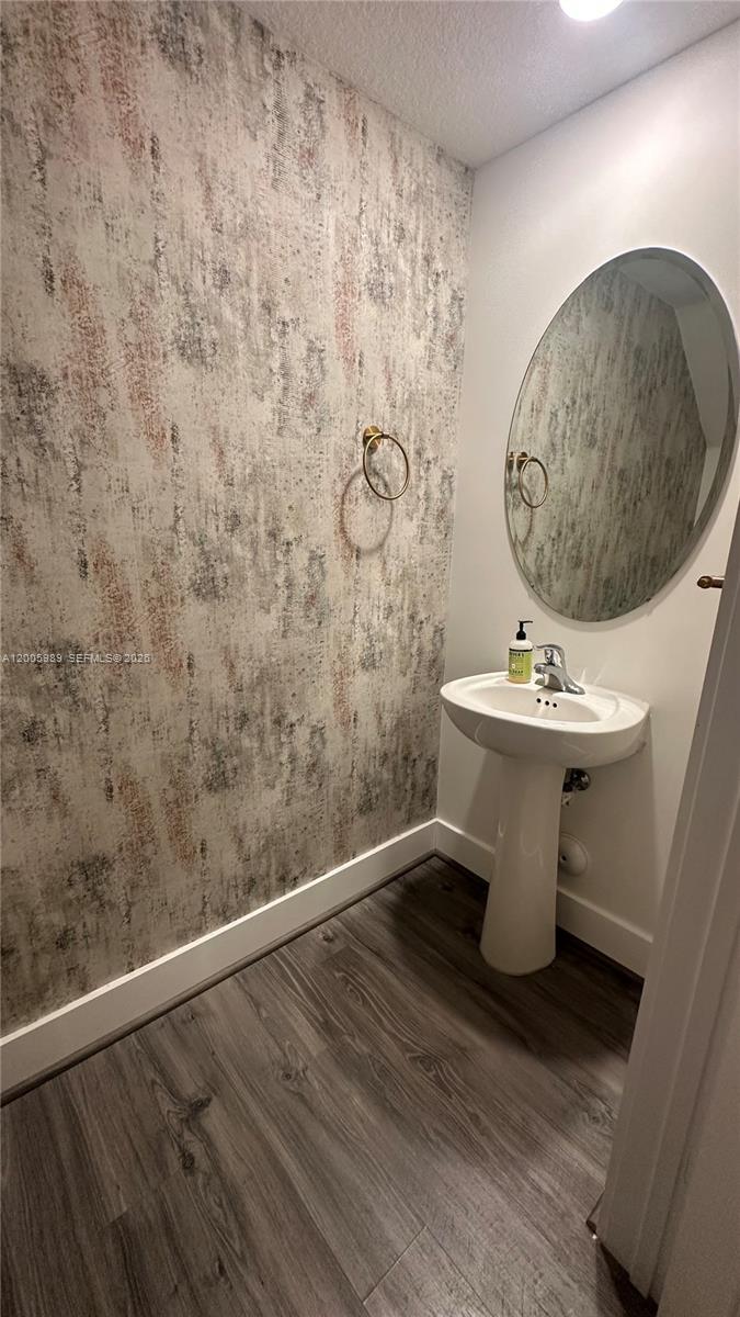 3423 West 110th Street Hialeah, FL 33018 - Photo 7 of 42 a bathroom with a toilet and a sink