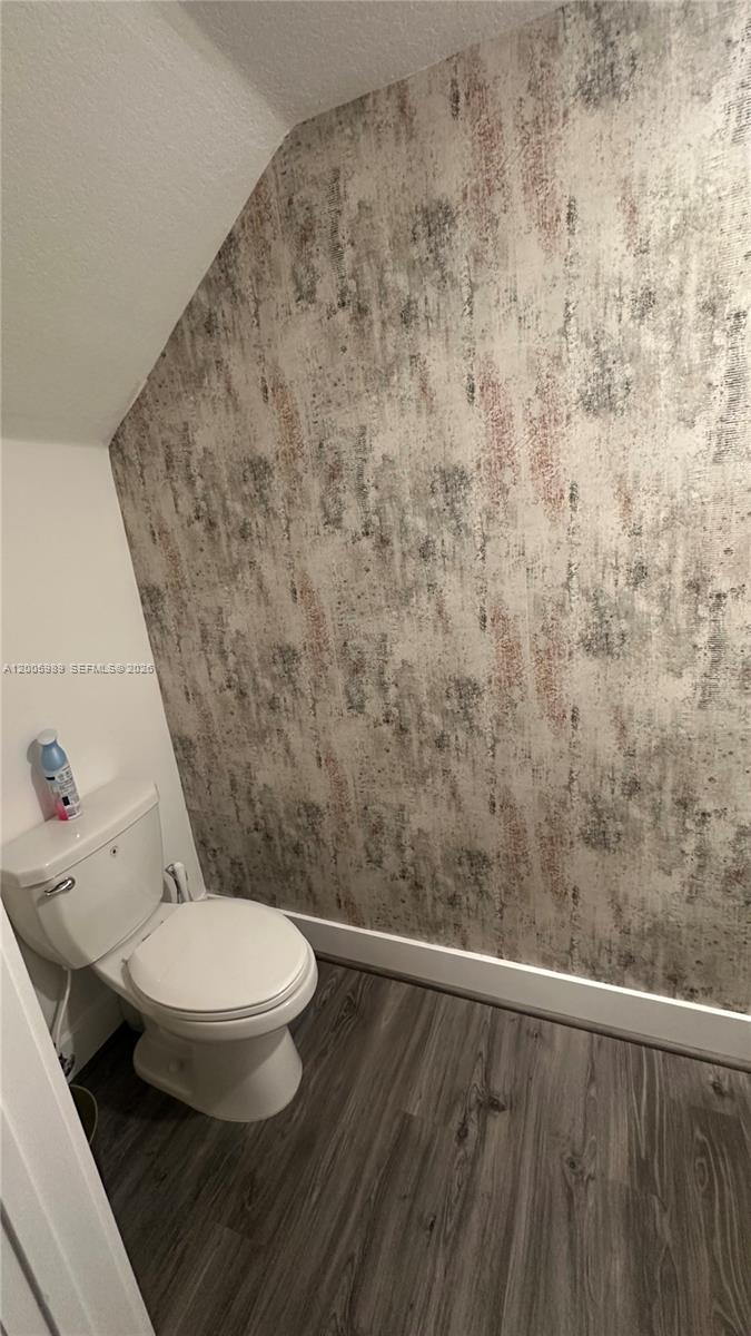 3423 West 110th Street Hialeah, FL 33018 - Photo 8 of 42 a bathroom with a toilet and a sink
