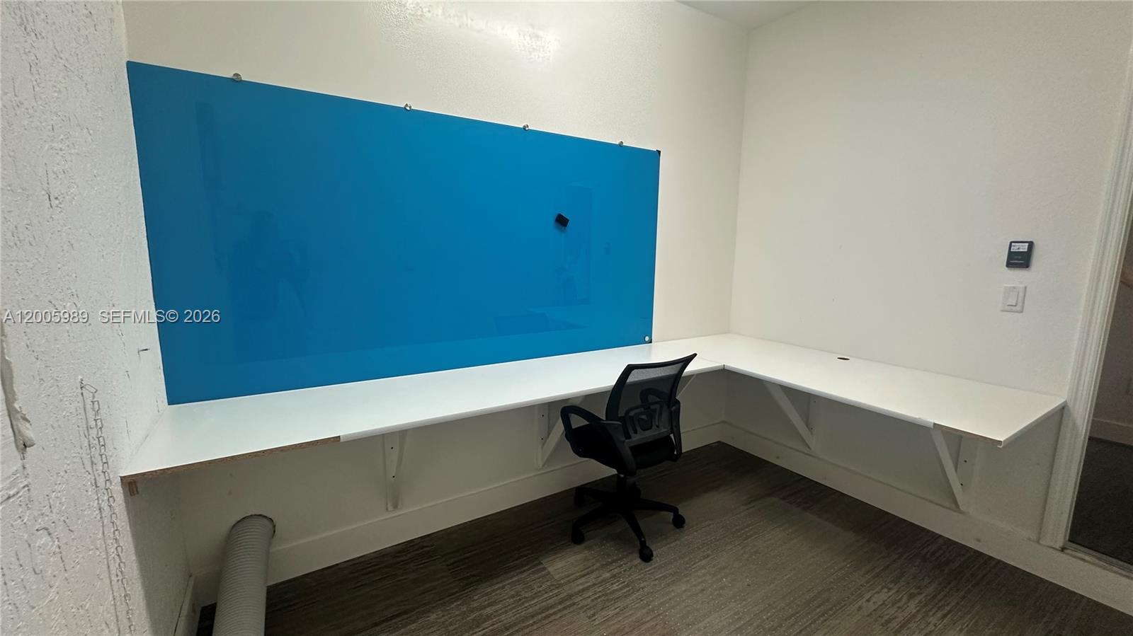 3423 West 110th Street Hialeah, FL 33018 - Photo 9 of 42 a bathroom with a bathtub and a chair