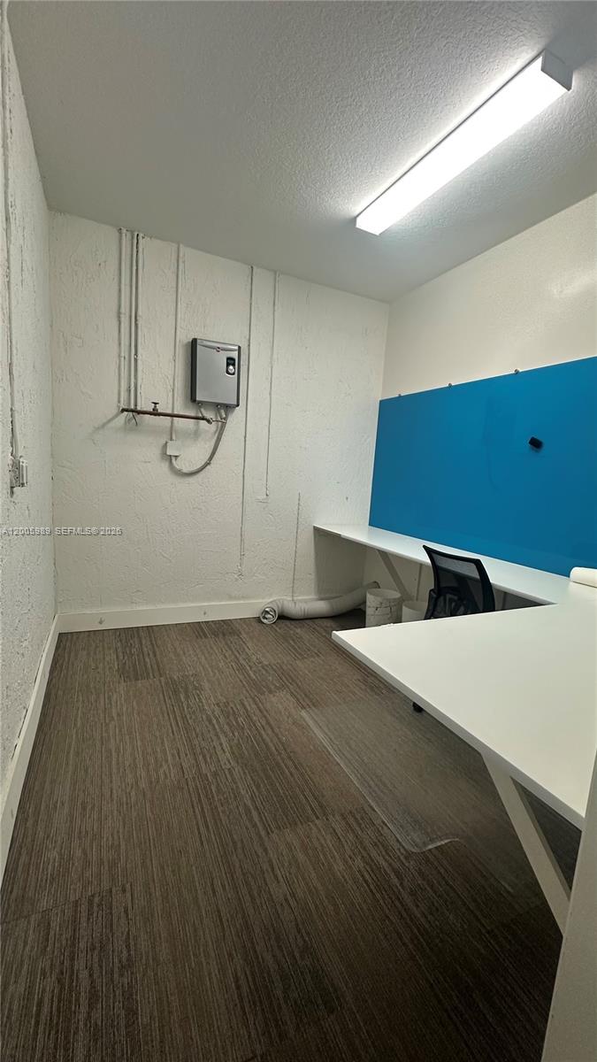 3423 West 110th Street Hialeah, FL 33018 - Photo 10 of 42 a room with lot of cabinets and wooden floor
