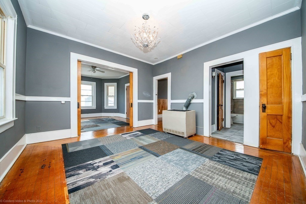 170 Buffinton Street Fall River, MA 02721 - Photo 17 of 38 a spacious bedroom with a bed and window