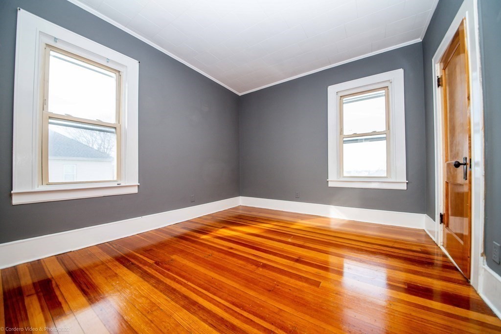 170 Buffinton Street Fall River, MA 02721 - Photo 19 of 38 a bedroom with a bed and a window