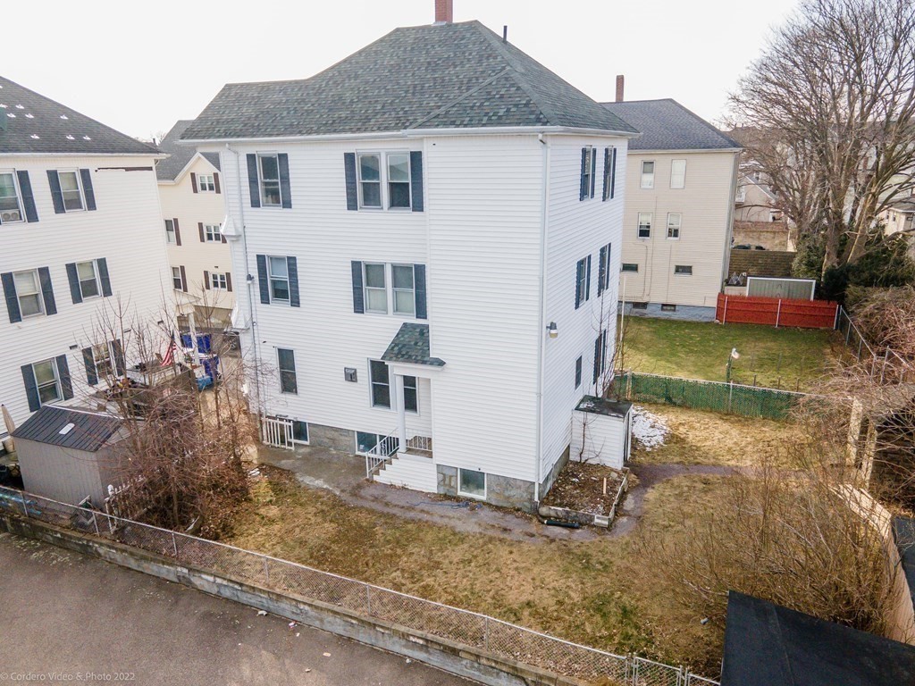 170 Buffinton Street Fall River, MA 02721 - Photo 2 of 38 a view of a white house with large windows next to a road