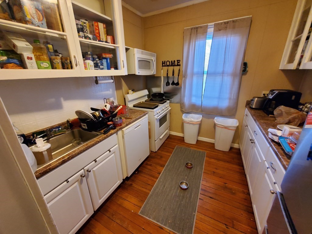 170 Buffinton Street Fall River, MA 02721 - Photo 26 of 38 a kitchen with a sink and cabinets
