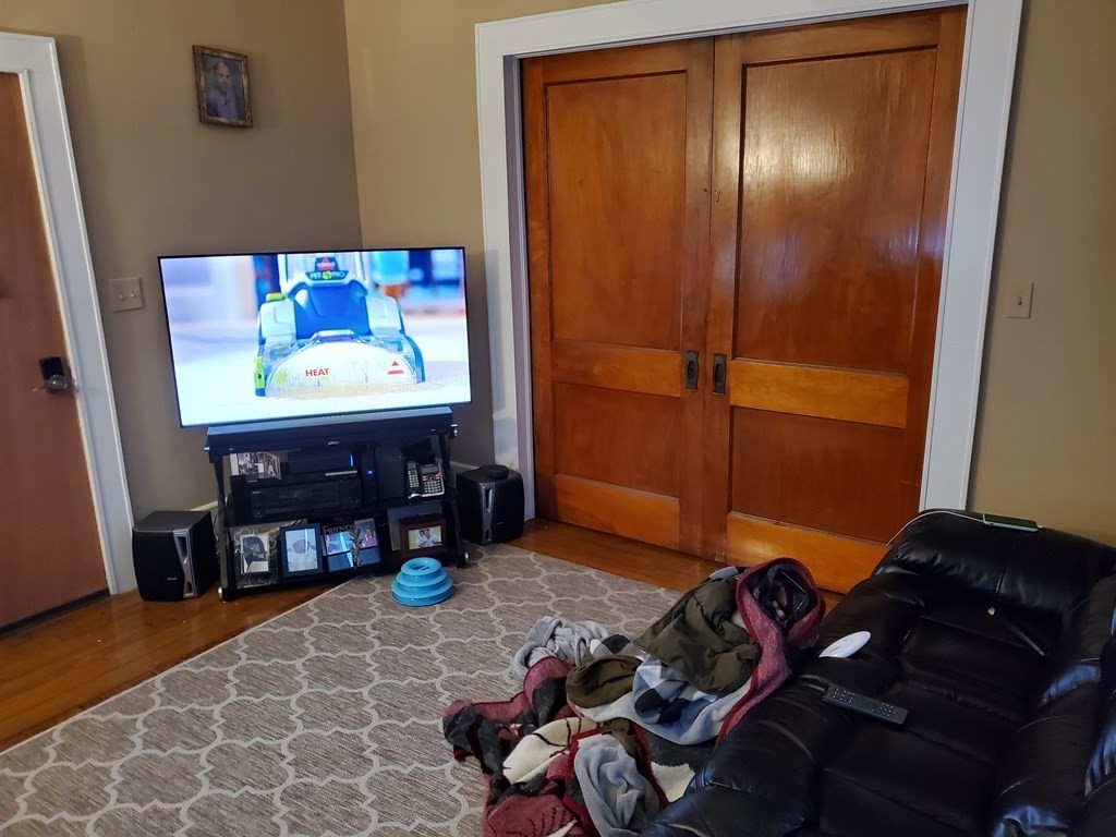 170 Buffinton Street Fall River, MA 02721 - Photo 27 of 38 a room with furniture and wooden floor