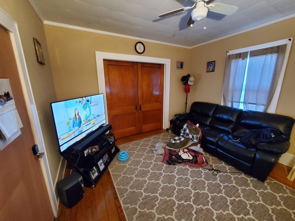 170 Buffinton Street Fall River, MA 02721 - Photo 28 of 38 a living room with furniture and a flat screen tv