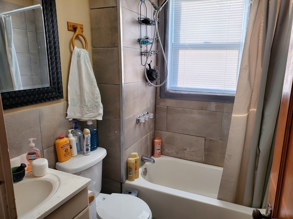 170 Buffinton Street Fall River, MA 02721 - Photo 29 of 38 a bathroom with a toilet sink and bathtub