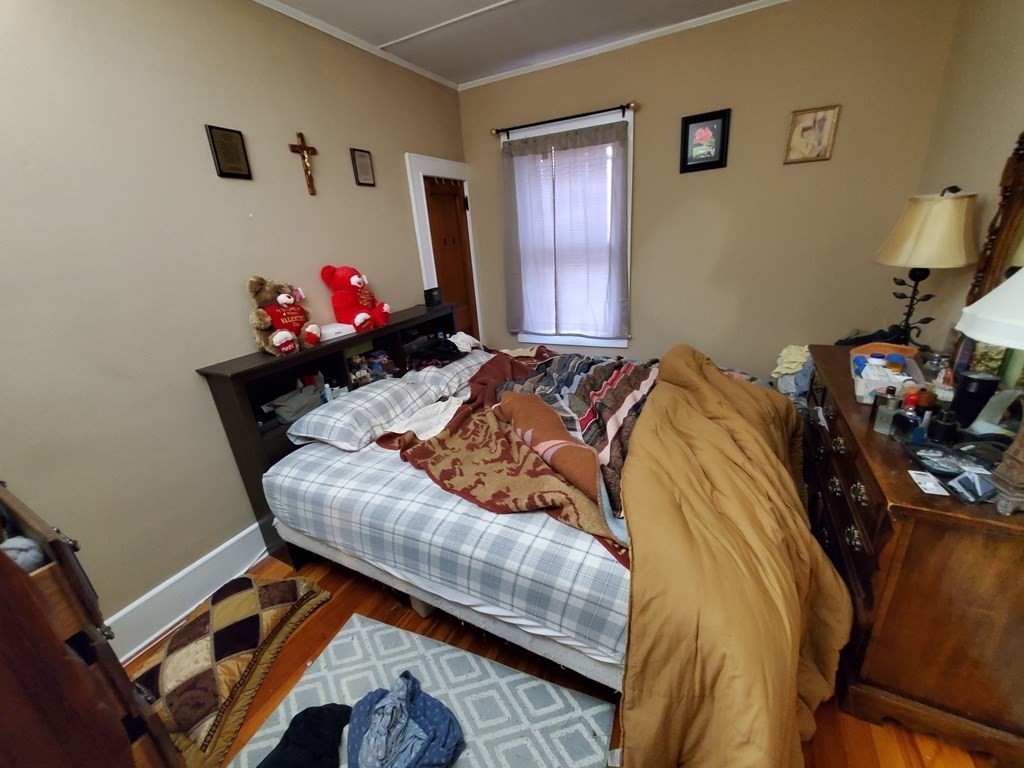 170 Buffinton Street Fall River, MA 02721 - Photo 32 of 38 a bed sitting in a bedroom next to a window