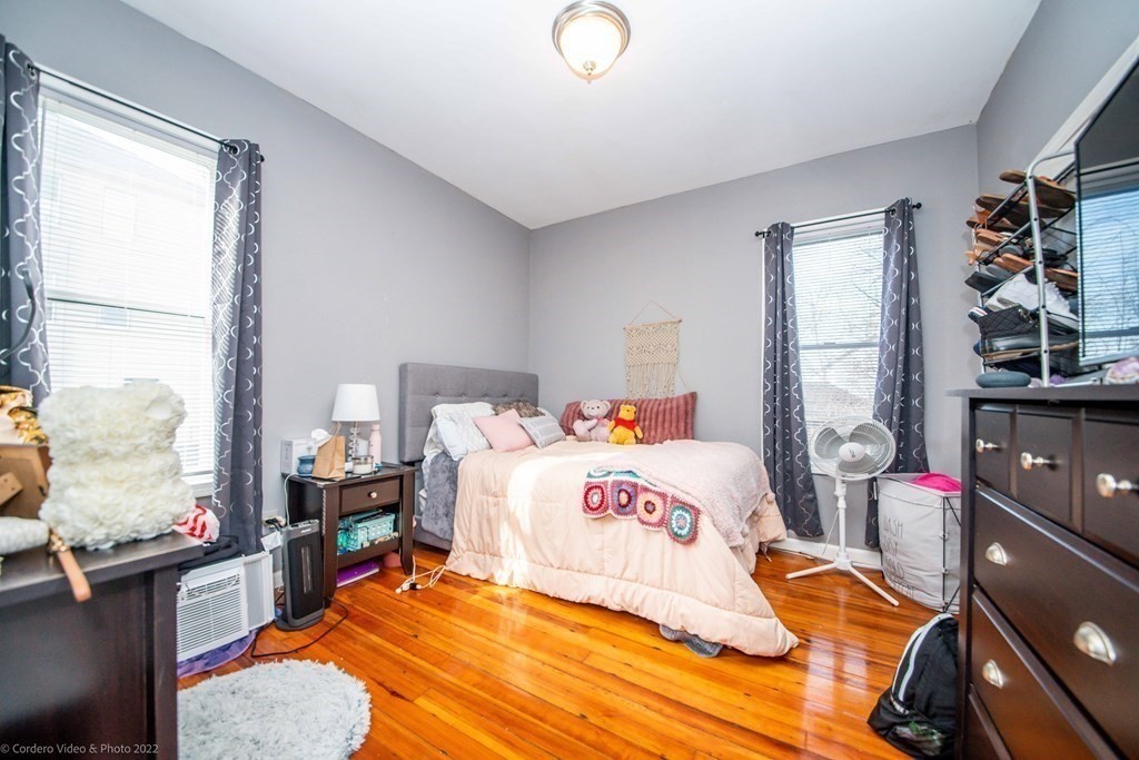 170 Buffinton Street Fall River, MA 02721 - Photo 10 of 38 a bedroom with a bed and wooden floor