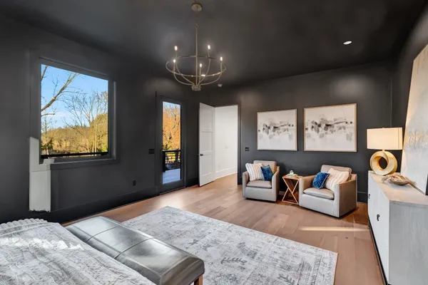 a hallway with a dresser and a window