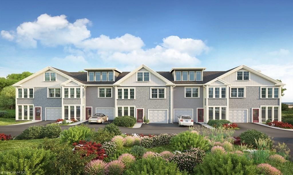 163 Atlantic Road, Unit 3 Gloucester, MA 01930 - Photo 2 of 12 a front view of a house with a garden