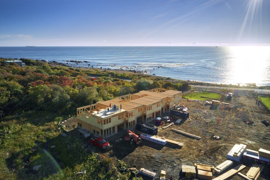 163 Atlantic Road, Unit 3 Gloucester, MA 01930 - Photo 5 of 12 an aerial view of residential houses with outdoor space and seating