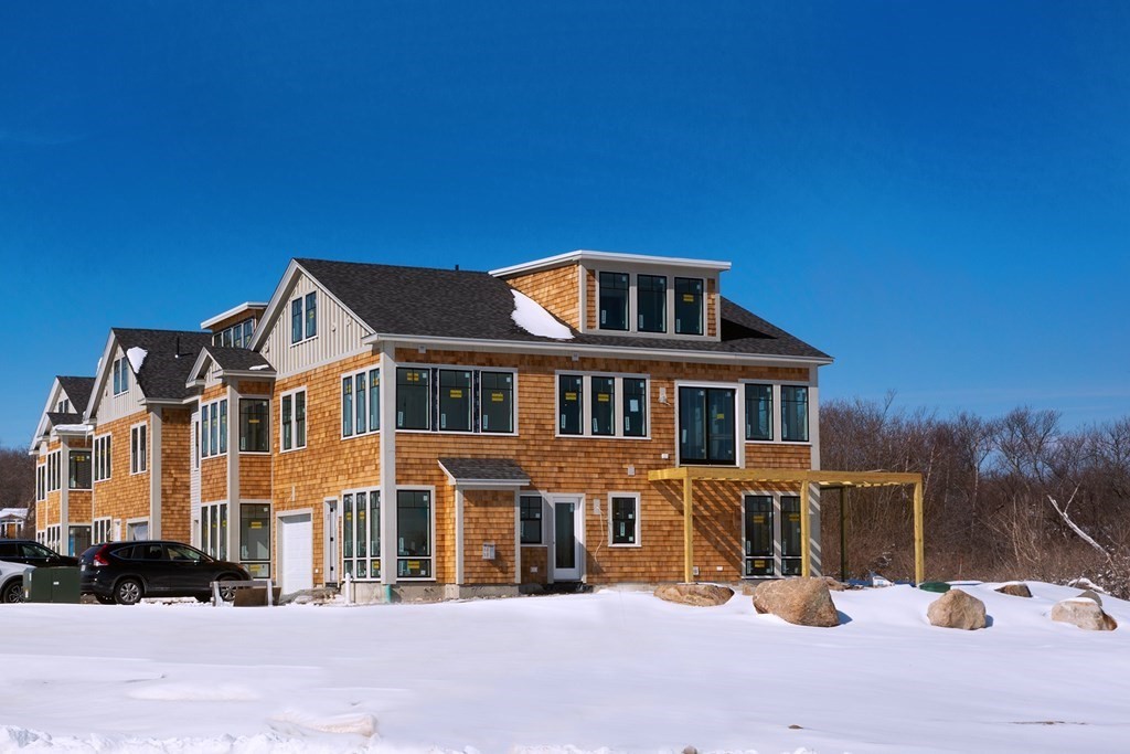 163 Atlantic Road, Unit 3 Gloucester, MA 01930 - Photo 7 of 12 a front view of a house with a yard