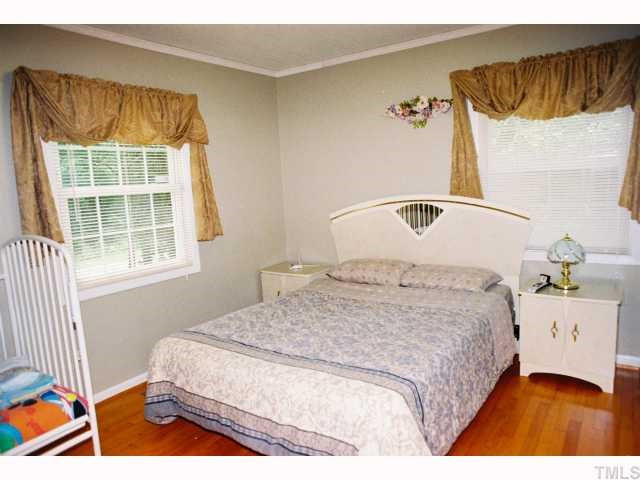 5028 Royal Acres Road Raleigh, NC 27610 - Photo 7 of 12 Master bedroom with hardwood floors