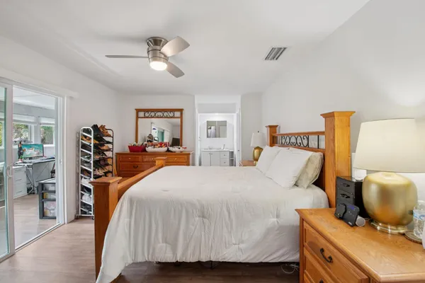 a bedroom with a bed and a dresser
