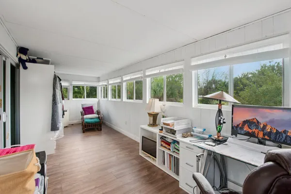 a view of a backyard with sitting area