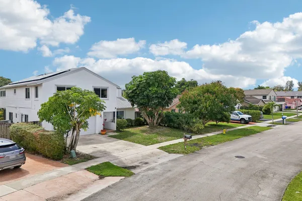 an aerial view of a house with an outdoor space