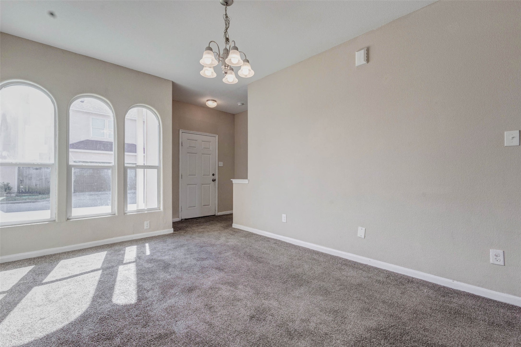 8622 Torcello Street Houston, TX 77031 - Photo 14 of 28 wooden floor in an empty room with a window
