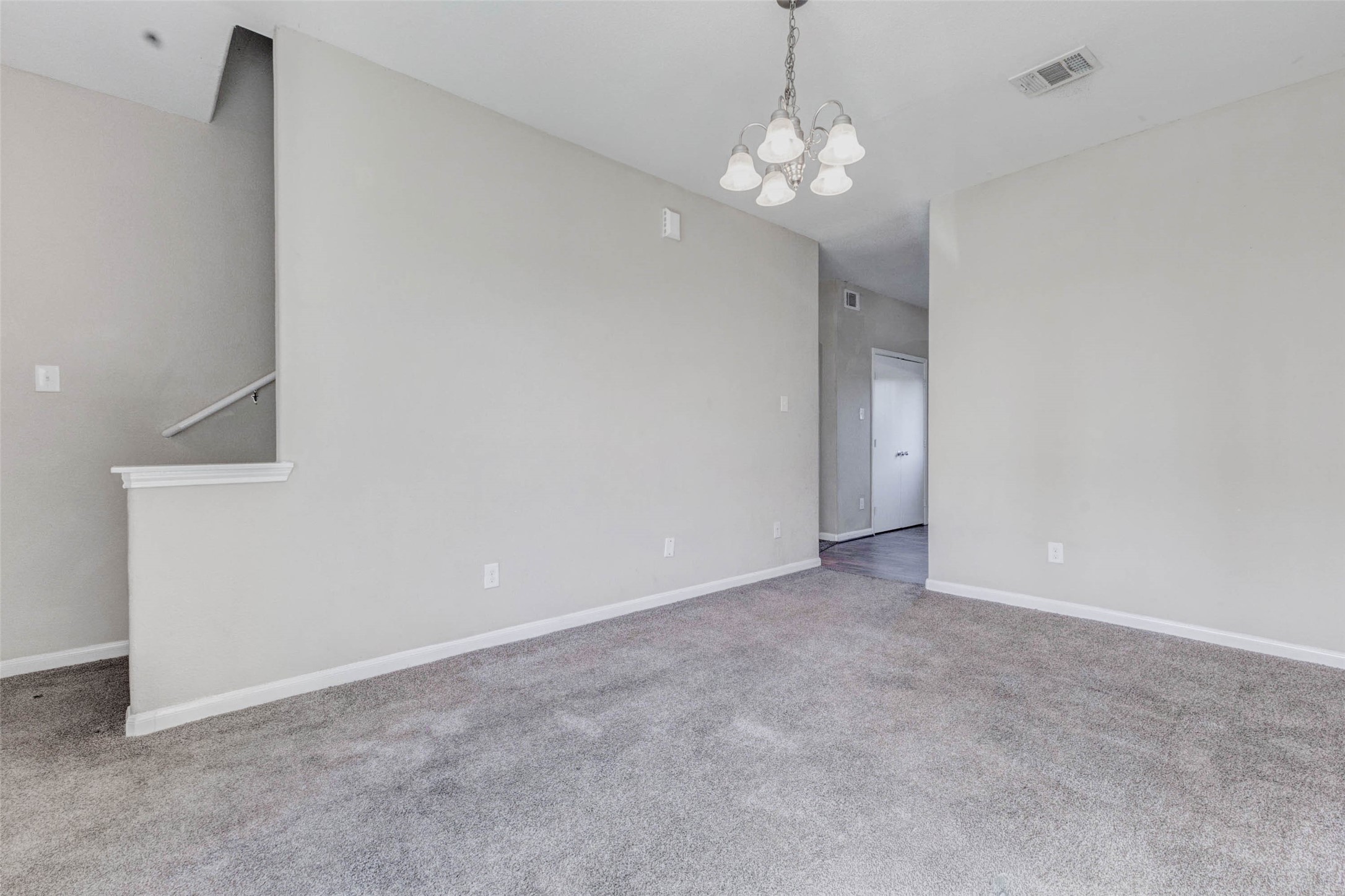 8622 Torcello Street Houston, TX 77031 - Photo 15 of 28 a view of an empty room with a chandelier fan