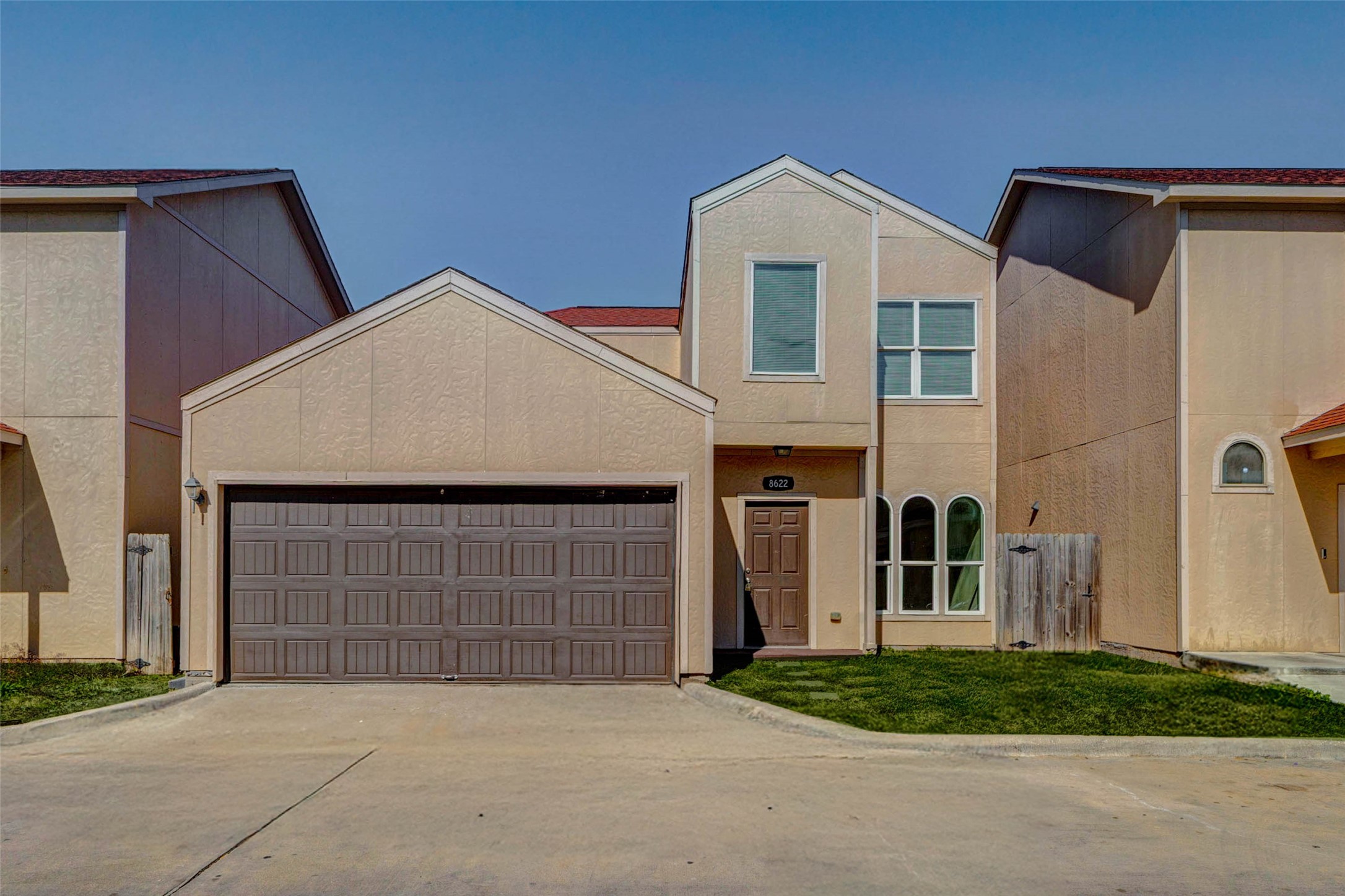 8622 Torcello Street Houston, TX 77031 - Photo 27 of 28 a front view of a house with a garden and garage