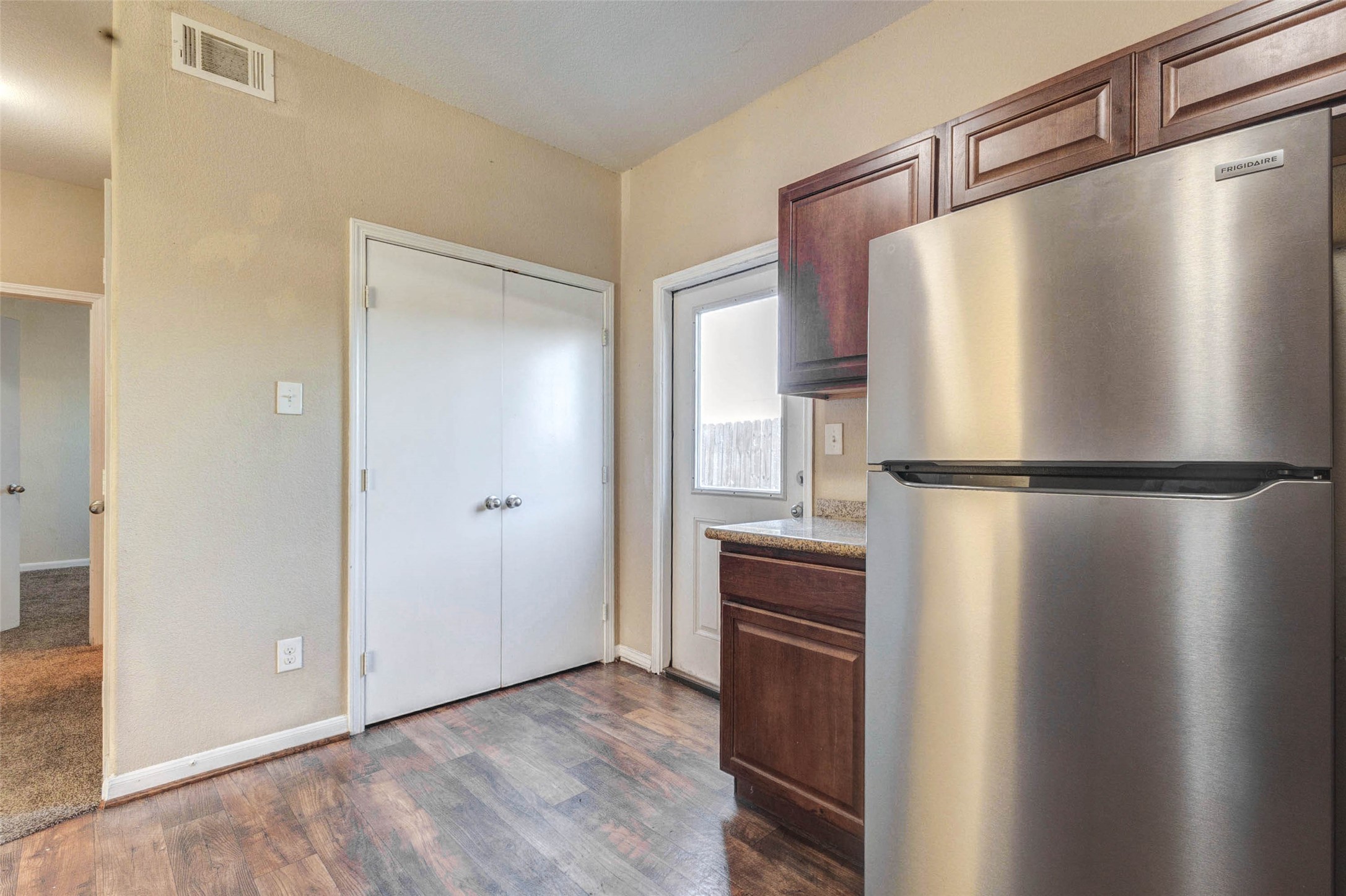 8622 Torcello Street Houston, TX 77031 - Photo 3 of 28 a kitchen with stainless steel appliances granite countertop a refrigerator and a sink