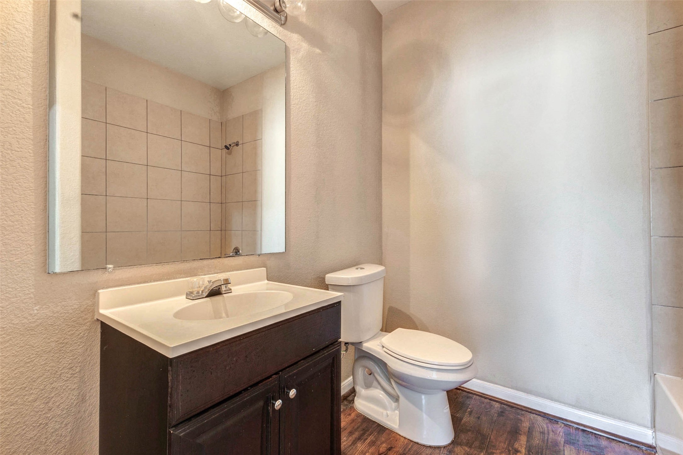 8622 Torcello Street Houston, TX 77031 - Photo 8 of 28 a bathroom with a toilet sink and mirror