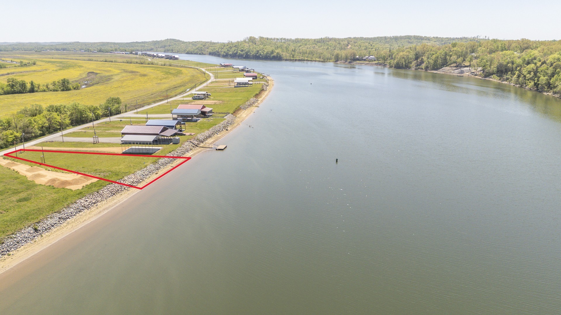2027 Hardin Bottom River Road Clifton, TN 38425 - Photo 1 of 33 a view of a lake with a mountain