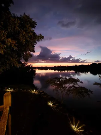 a view of a lake in front of a house