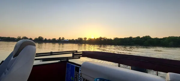 a sunset view with a lake