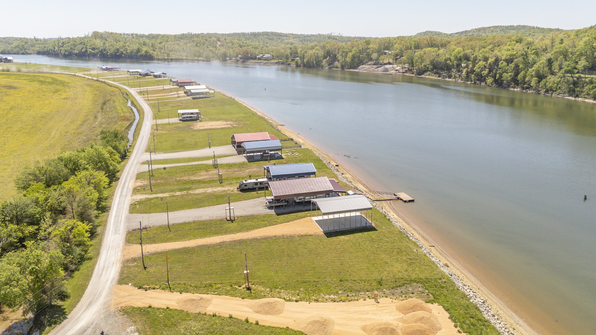 2027 Hardin Bottom River Road Clifton, TN 38425 - Photo 3 of 33 a view of a swimming pool with a lake view