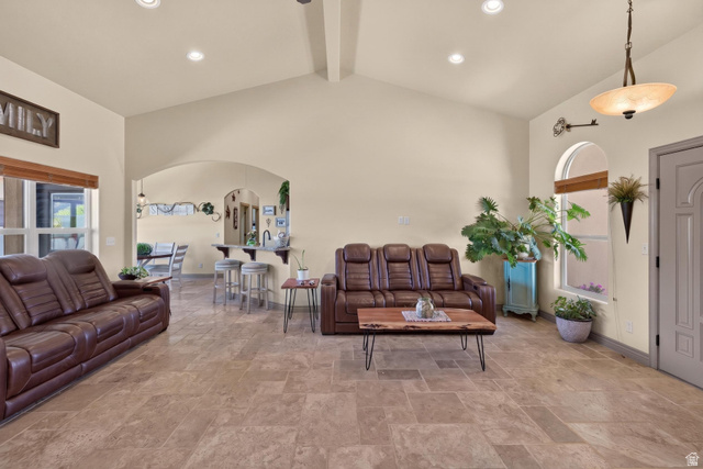 4635 East Sunny Acres Lane Moab, UT 84532 - Photo 41 of 56 Spacious living area featuring neutral wall tones, tile flooring, and a vaulted ceiling with recessed lighting