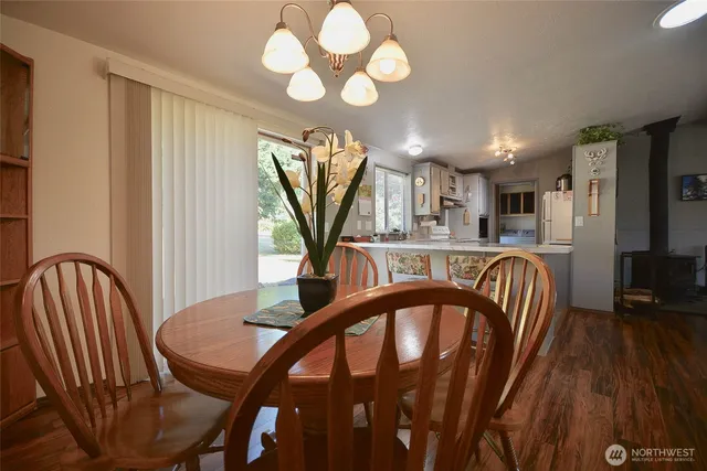 a dining room with furniture and window