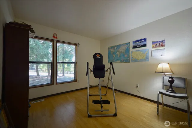 a room with gym equipment and a window
