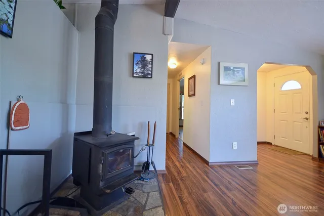 a view of a room with wooden floor and cabinet